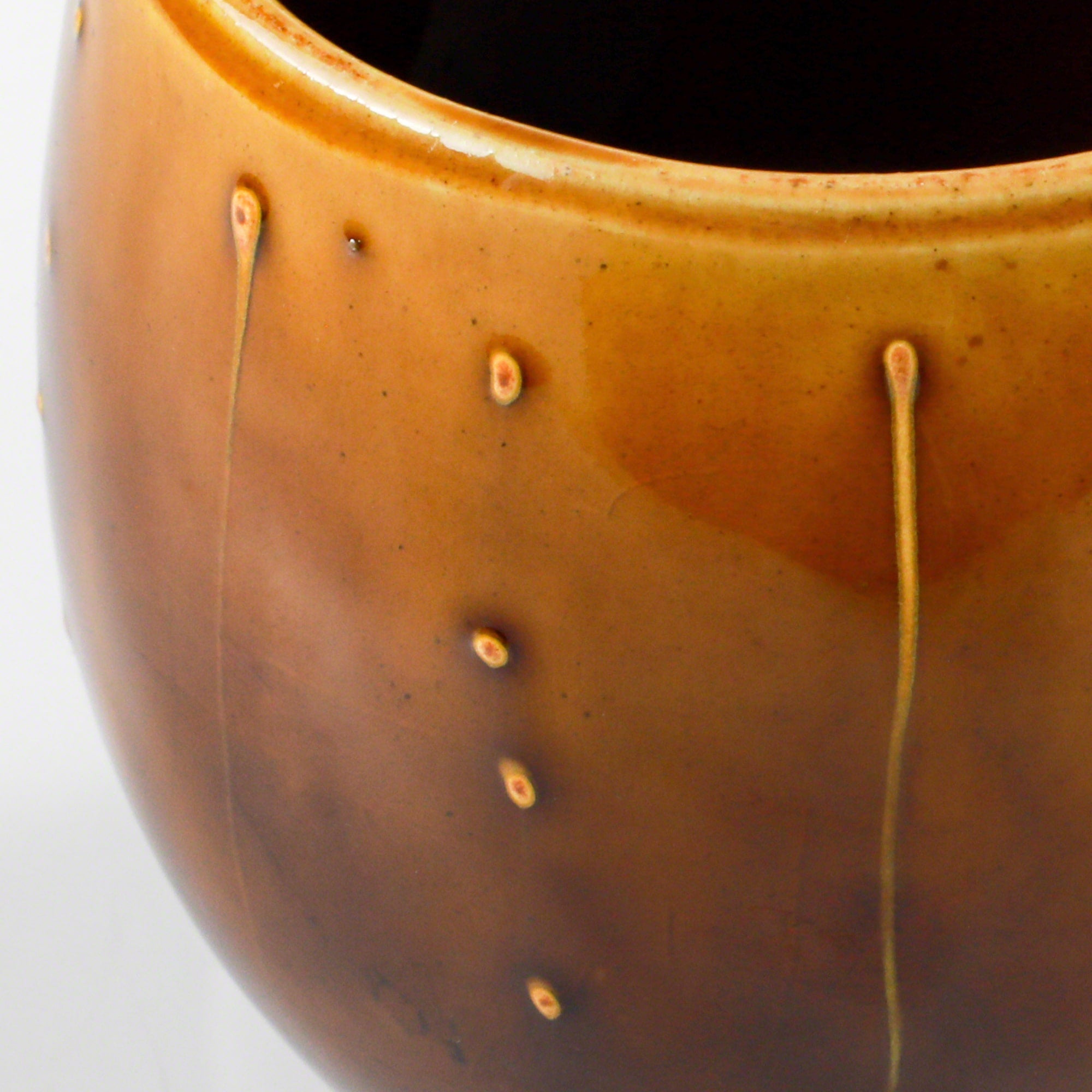 Close-up of the glaze in the Asayu Japan Ceramic Coffee Mug in caramel.