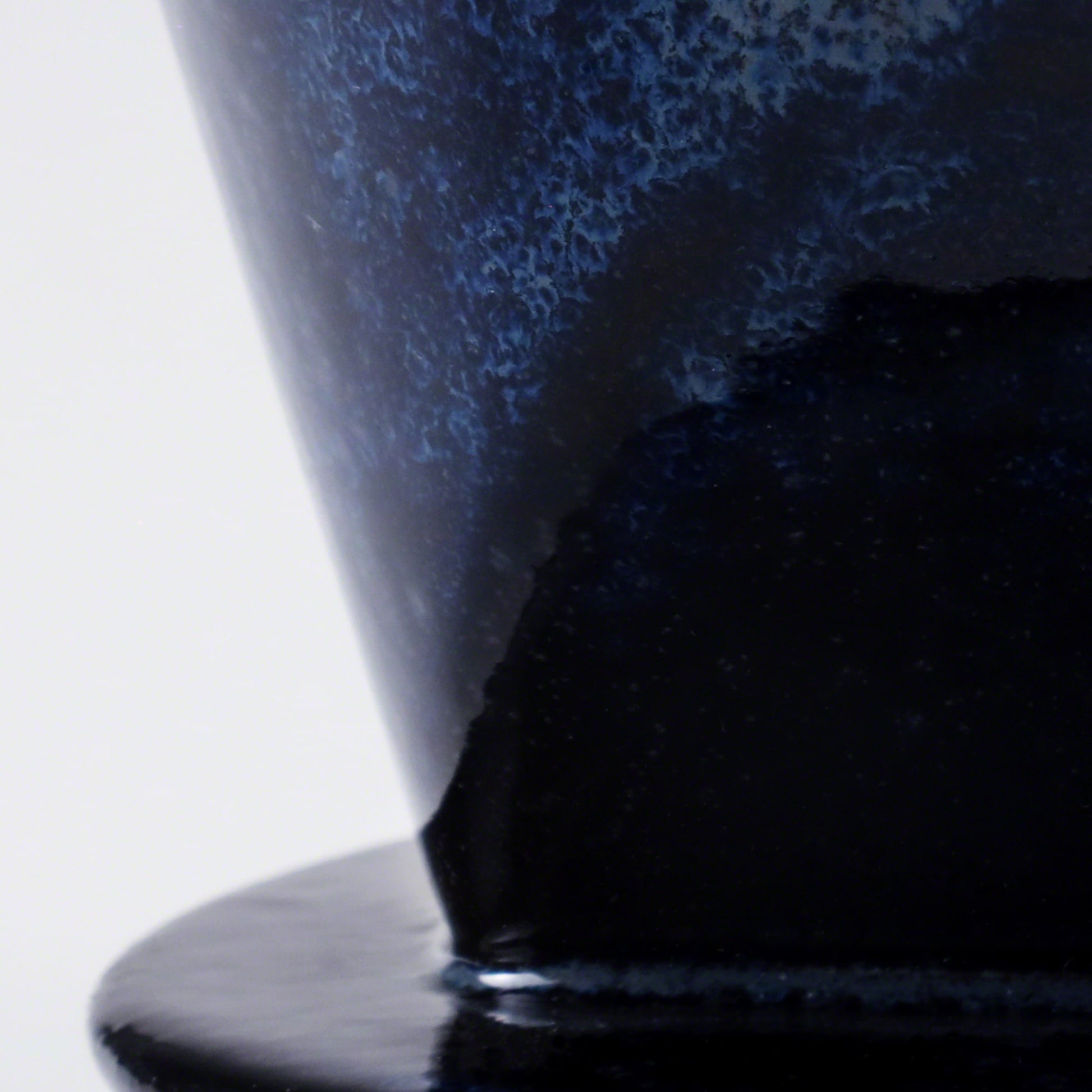 Close-up of the glaze in the Asayu Japan Ceramic Coffee Dripper in dark navy blue..