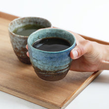Cargar imagen en el visor de la galería, Asayu Japan Handpainted Glazed Ceramic Tea Cups Set of 2 in Blue and White with tea inside.
