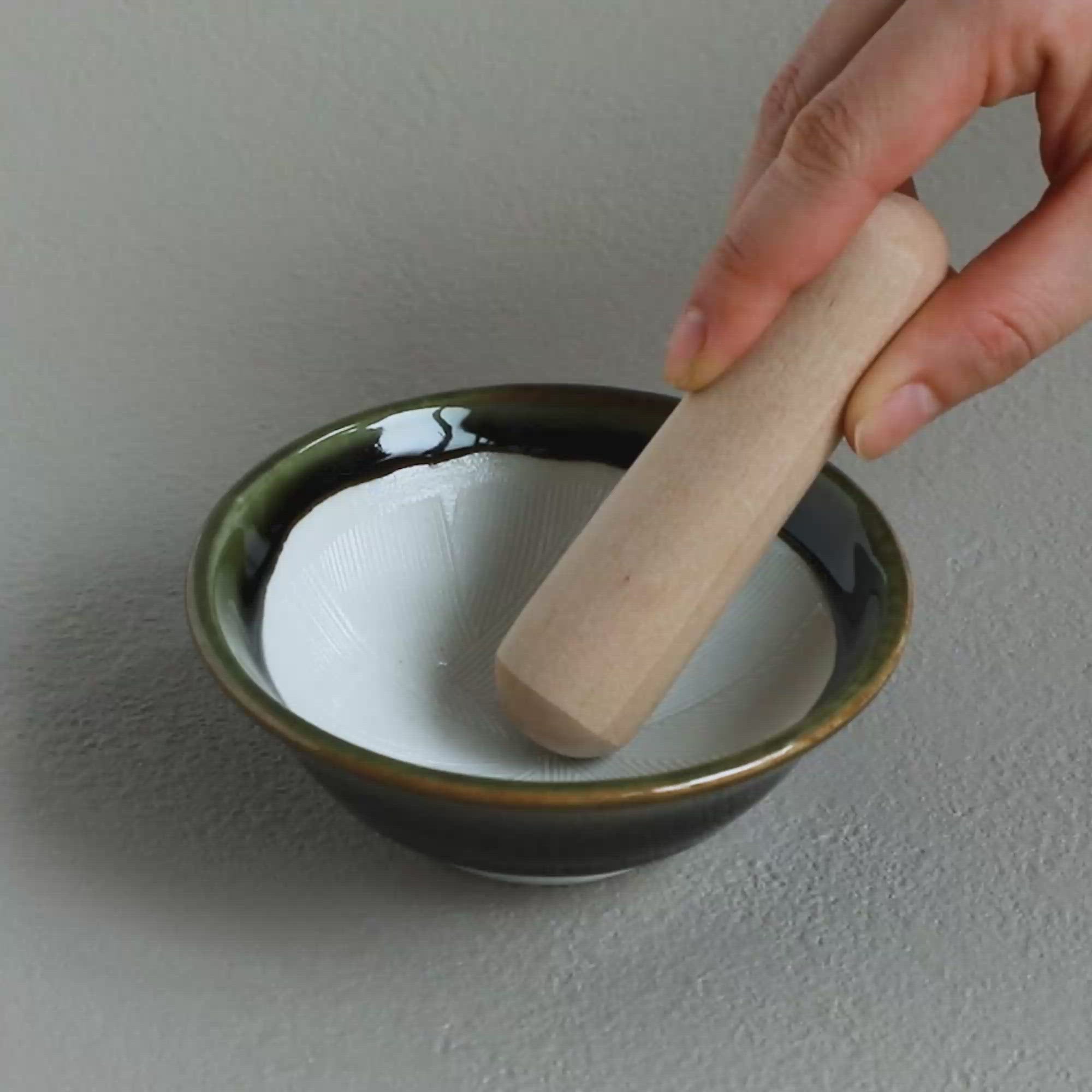 Video showing how to use the Ceramic Olive Green Mortar Bowl with Wooden Pestle by Asayu Japan