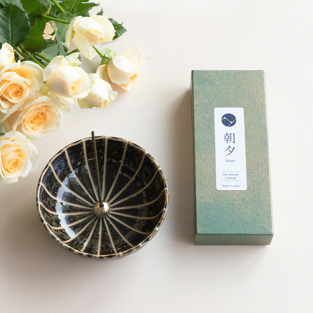 Asayu Japan Dark Green Lotus Incense Holder next to Floral Incense Set with Rose and Jasmine Low Smoke Incense Sticks and yellow roses.