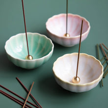 Load image into Gallery viewer, The three incense holders from the Asayu Japan Mini Lotus Flower collection: turquoise model, cherry blossom pink model and white and yellow model.
