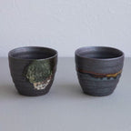 Video showing the Asayu Japan Handpainted Glazed Ceramic Tea Cups Set of 2 in Dark Metallic Brown.