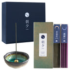 blue gift box next to aquamarine incense holder and floral incense sticks set